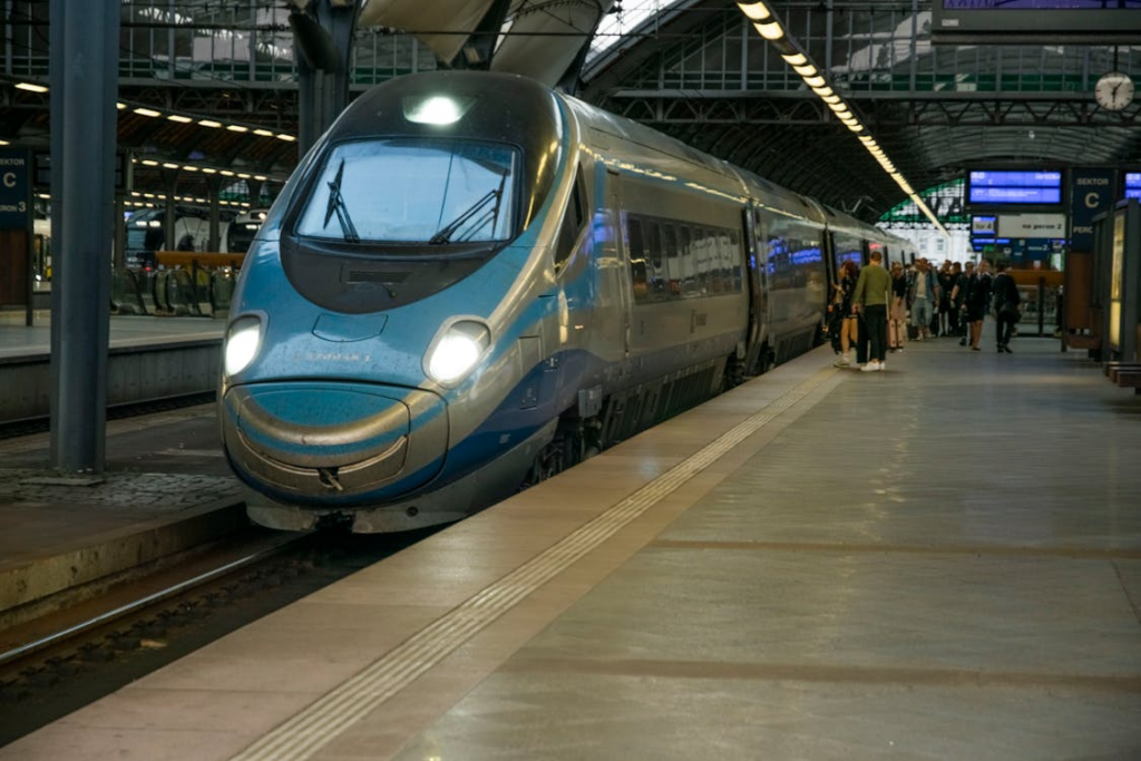 Public transit technology around the world shown through a high-speed train at a modern station