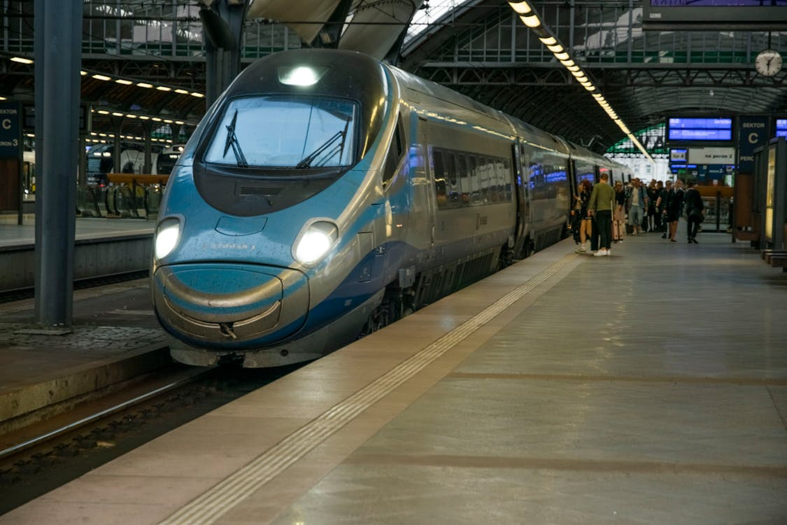 Public transit technology around the world shown through a high-speed train at a modern station