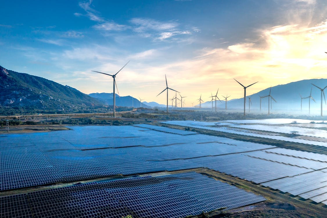 Solar panels and wind turbines in a renewable energy leaders country generating clean power